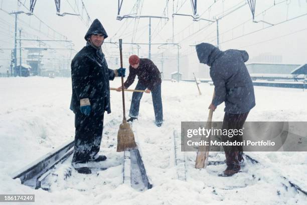 Ferrovie dello Stato workers cleaning the rails from snow. One hundred and forty million cubic meters of snow fell in the city between Sunday 13th...