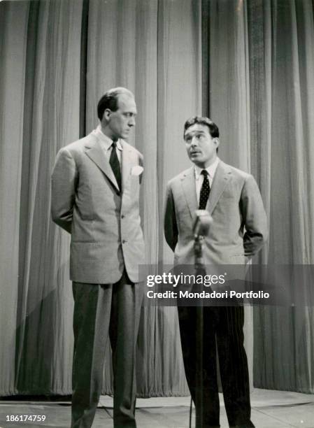 Italian TV presenter and actor Raimondo Vianello and Italian actor, director and scriptwriter Ugo Tognazzi playing a gag in the TV variety show put...