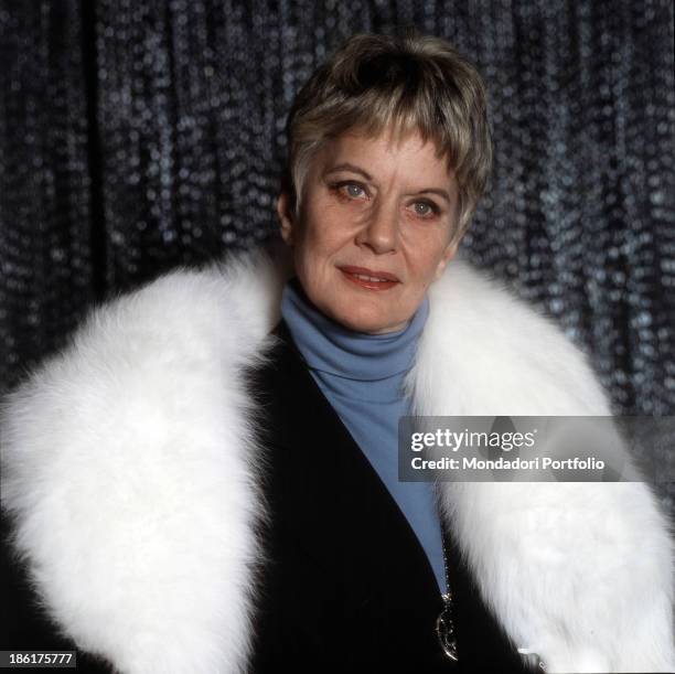 Italian baroness and singer Alida Valli wearing a white fox fur scarf. 1981.