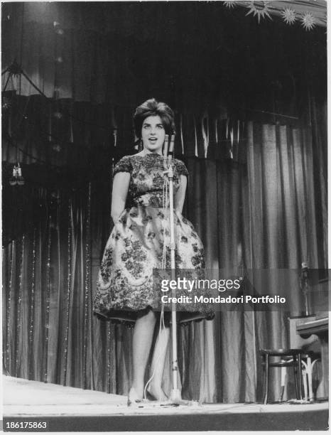 Italian singer Mina performing at 10th Sanremo Music Festival. Sanremo, January 1960.
