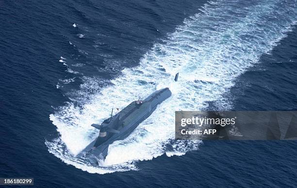 This undated picture shows a nuclear-powered submarine of the People's Liberation Army Navy's North Sea Fleet preparing to dive into the sea. Beijing...