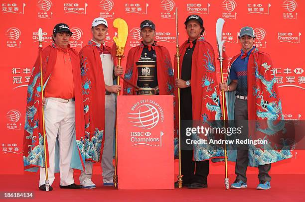 Defending champion Ian Poulter of England poses on stage with Jason Dufner of the USA, Justin Rose of England, Phil Mickelson of the USA and Rory...