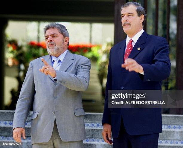 Mexican President Vicente Fox , and Brazilian president elect Luiz Inacio Lula da Silva , speak with reporters outside of the presidential house in...