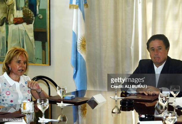 Argentine President Eduardo Duhalde attends a meeting with his cabinet including his wife Hilda "Chiche" de Duhalde 02 January at the Olivos...
