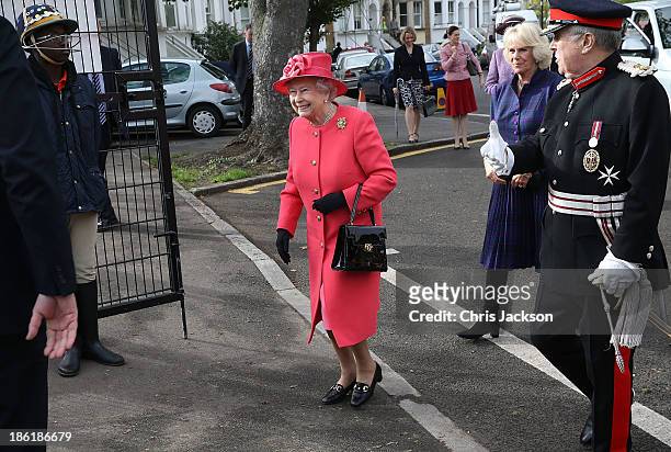 Queen Elizabeth II and Camilla, Duchess of Cornwall arrive at Ebony Horse Club & Community Riding Centre on October 29, 2013 in London, England.