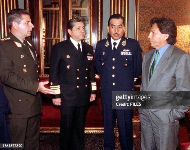 Photo taken in 01 August 2001 of General Victor Bustamante, Vice Admiral Alfredo Palacios, and Air Force General Jorge del Carpio with Peruvian...