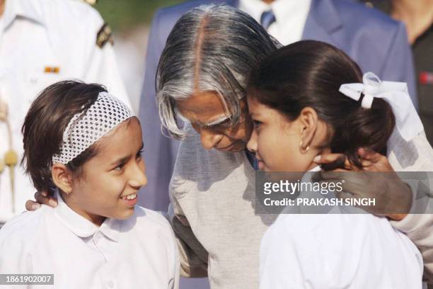 Indian President A.P.J. Abdul Kalam chats with young girls at the memorial for India's first prime minister Jawahar Lal Nehru in New Delhi, 14...