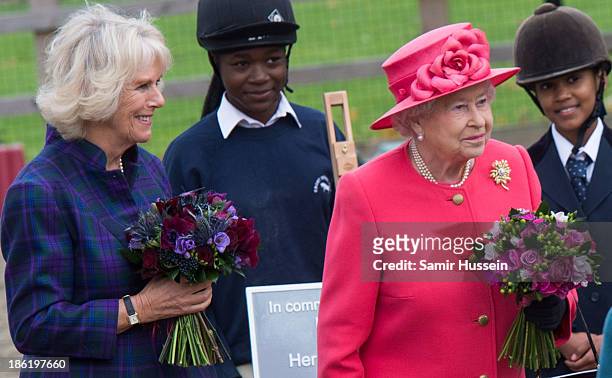 Queen Elizabeth II and Camilla, Duchess of Cornwall visit Ebony Horse Club And Community Riding Centre, Brixton on October 29, 2013 in London,...