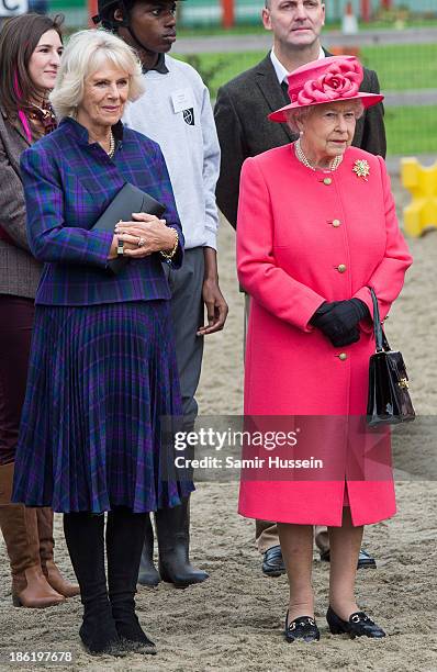 Queen Elizabeth II and Camilla, Duchess of Cornwall visit Ebony Horse Club And Community Riding Centre, Brixton on October 29, 2013 in London,...