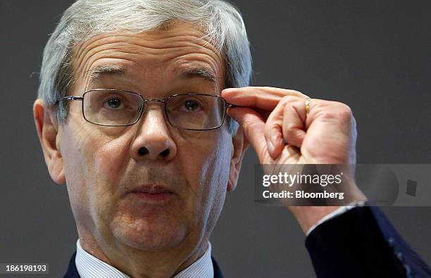 Philippe Varin, chief executive officer of PSA Peugeot Citroen, adjusts his spectacles during a news conference to inaugurate the production line for...