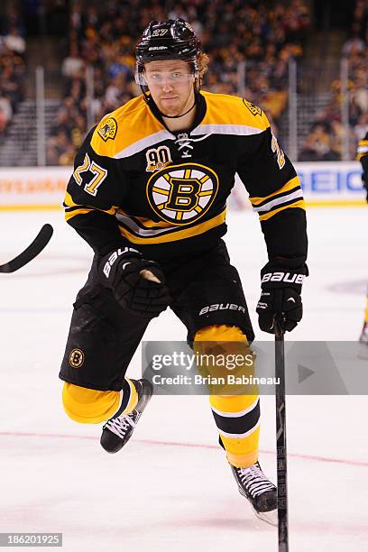 Dougie Hamilton of the Boston Bruins skates against the New Jersey Devils at the TD Garden on October 26, 2013 in Boston, Massachusetts.