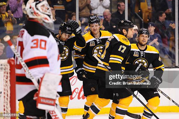 Jarome Iginla, Dougie Hamilton, Milan Lucic and Dennis Seidenberg of the Boston Bruins celebrate a goal against the New Jersey Devils at the TD...