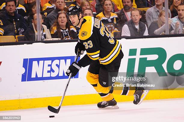 Zdeno Chara of the Boston Bruins skates with the puck against the New Jersey Devils at the TD Garden on October 26, 2013 in Boston, Massachusetts.