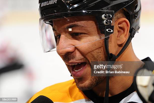 Jarome Iginla of the Boston Bruins gets interviewed during warm ups prior to the game against the New Jersey Devils at the TD Garden on October 26,...