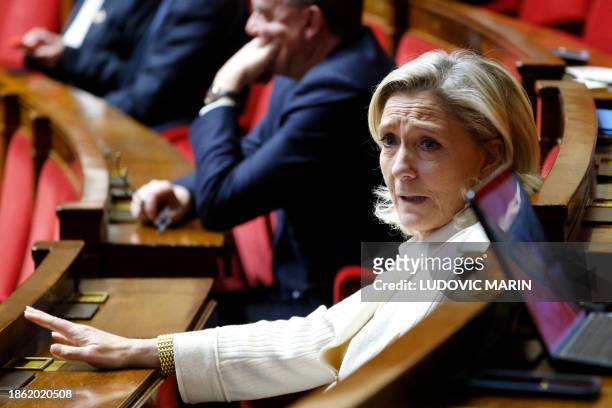 French Member of Parliament and president of the 'Rassemblement National' group Marine Le Pen attends a session of questions to the Government at the...