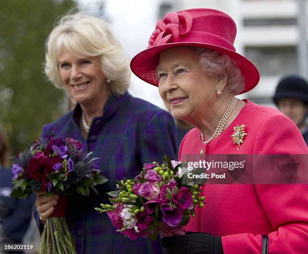 Queen Elizabeth II and Camilla, Duchess of Cornwall during a visit to Ebony Horse Club & Community Riding Centre on October 29, 2013 in London,...