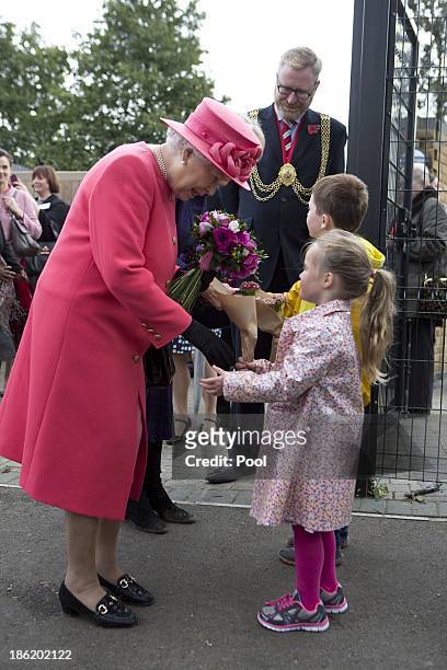 Queen Elizabeth II during a visit to Ebony Horse Club & Community Riding Centre on October 29, 2013 in London, England.