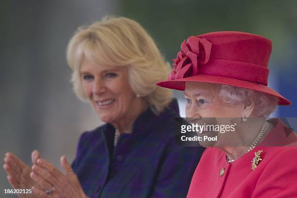 Queen Elizabeth II and Camilla, Duchess of Cornwall during a visit to Ebony Horse Club & Community Riding Centre on October 29, 2013 in London,...