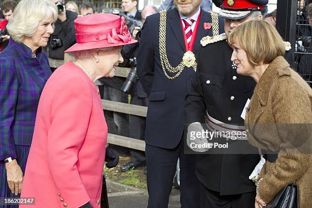 Queen Elizabeth II and Camilla, Duchess of Cornwall meet Tessa Jowell MP during a visit to Ebony Horse Club & Community Riding Centre on October 29,...