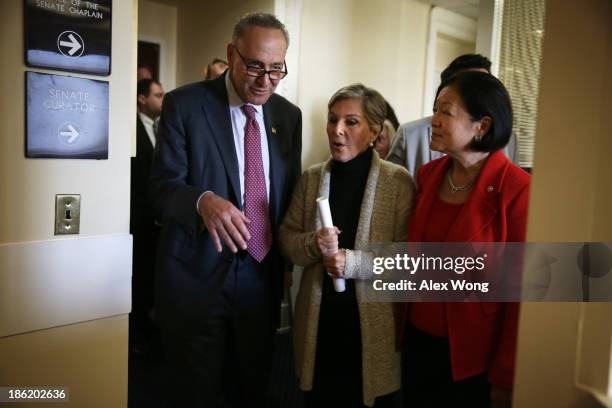 Sen. Barbara Boxer , Sen. Charles Schumer , and Sen. Mazie Hirono leave after a news conference on debt ceiling increases October 29, 2013 on Capitol...