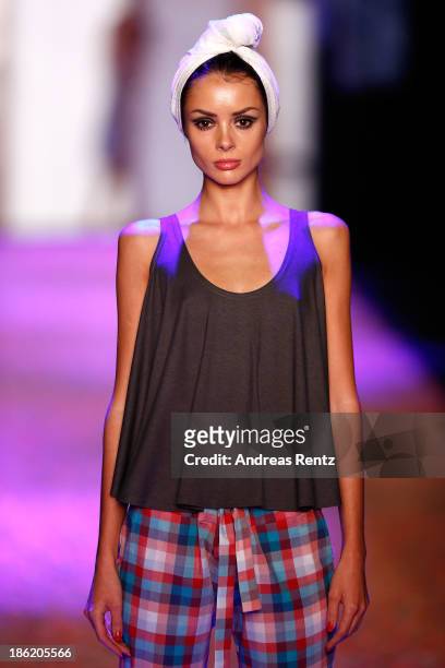 Model walks on the runway at the Maroussia Zaitseva show during Mercedes-Benz Fashion Week Russia S/S 2014 on October 29, 2013 in Moscow, Russia.