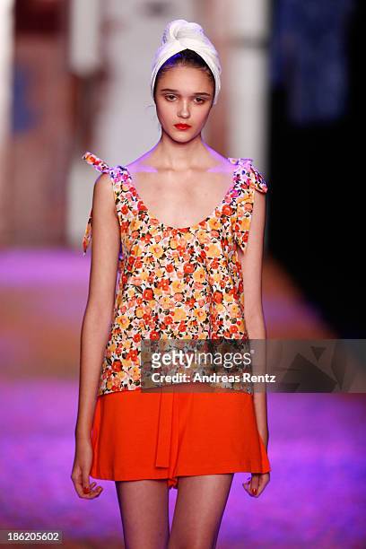 Model walks on the runway at the Maroussia Zaitseva show during Mercedes-Benz Fashion Week Russia S/S 2014 on October 29, 2013 in Moscow, Russia.