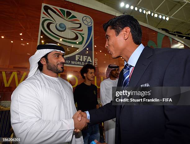 Sheiek Abdullah Bin Mohamed Bin Khalid Alinhayah welcomes Eddie Morales of FIFA during the round of 16 match between Nigeria and Iran at Khalifa Bin...