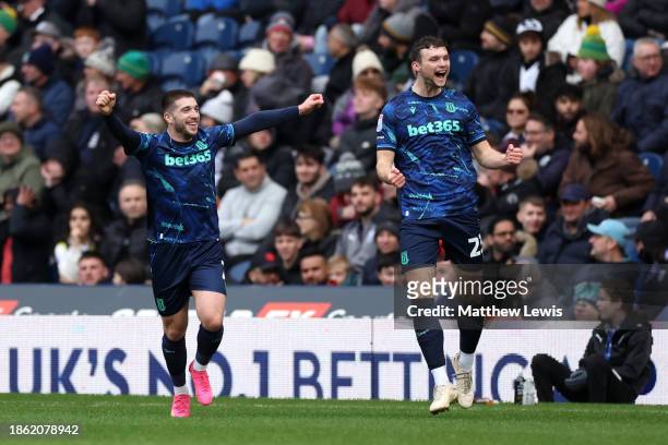 Lynden Gooch of Stoke City celebrates with Luke McNally of Stoke City after scoring their team's first goal during the Sky Bet Championship match...