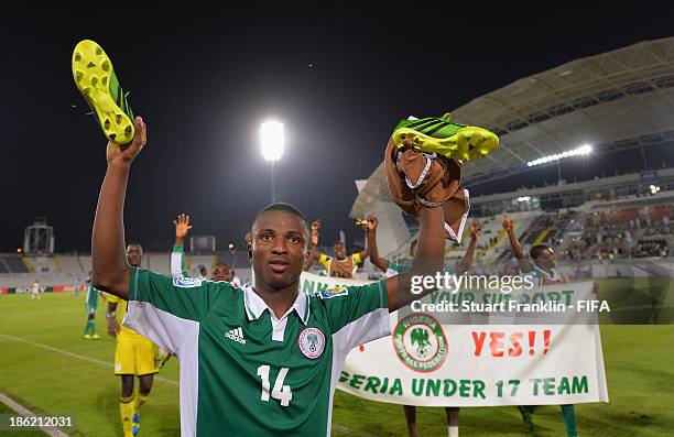 Chidiebere Nwakali of Nigeria celebrates his teams win at the end of the round of 16 match between Nigeria and Iran at Khalifa Bin Zayed Stadium on...