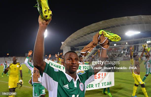 Chidiebere Nwakali of Nigeria celebrates his teams win at the end of the round of 16 match between Nigeria and Iran at Khalifa Bin Zayed Stadium on...