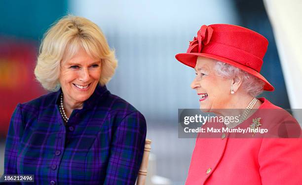 Camilla, Duchess of Cornwall and Queen Elizabeth II watch a riding display as they visit the Ebony Horse Club and Community Riding Centre on October...