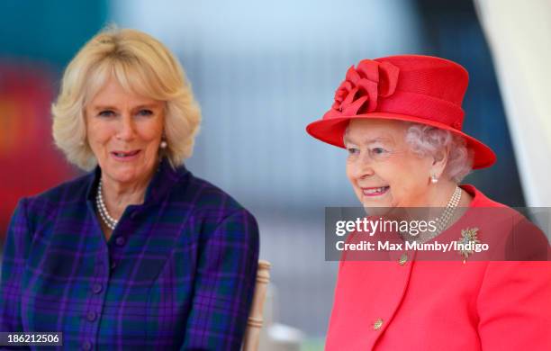 Camilla, Duchess of Cornwall and Queen Elizabeth II watch a riding display as they visit the Ebony Horse Club and Community Riding Centre on October...