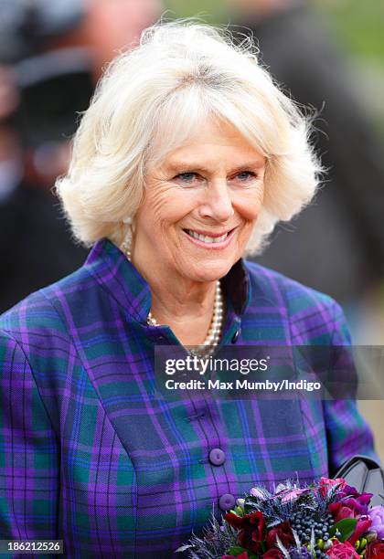 Camilla, Duchess of Cornwall accompanies Queen Elizabeth II on a visit to the Ebony Horse Club and Community Riding Centre on October 29, 2013 in...