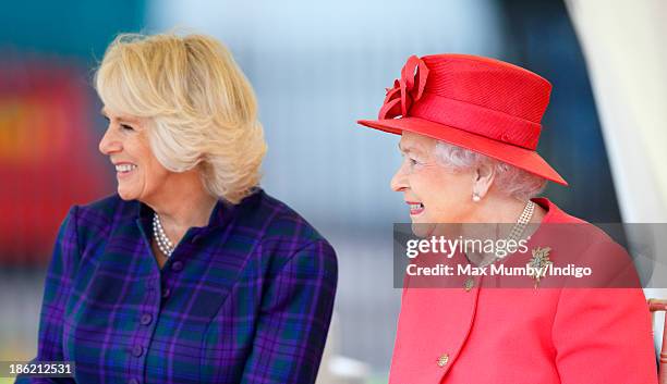 Camilla, Duchess of Cornwall and Queen Elizabeth II watch a riding display as they visit the Ebony Horse Club and Community Riding Centre on October...