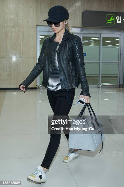 Hyoyeon of South Korean girl group Girls' Generation is seen upon arrival at the Gimpo Airport on October 28, 2013 in Seoul, South Korea.