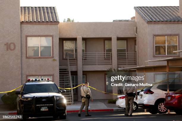 Police still stake out the apartment, background, where UNLV shooter Anthony Polito lived at the Promontory Point Apartments in Henderson a day after...
