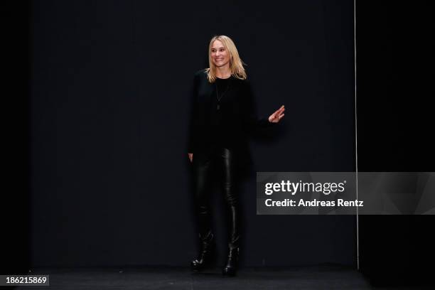 Designer Masha Kravtsova appears at the end of the runway of the The Muscovites By Masha Kravtsova show during Mercedes-Benz Fashion Week Russia S/S...