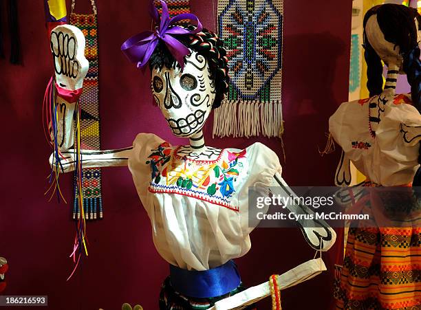 Figure in the "Celebrating Life" display at the Mexican Cultural Center's Día de Muertos exhibit on Monday, October 21, 2013. The exhibit portrays a...