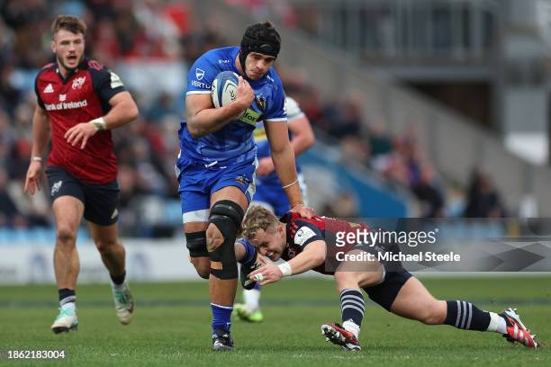 Dafydd Jenkins of Exeter holds off the challenge from Munster's Craig Casey during the Investec Champions Cup match between Exeter Chiefs and Munster...