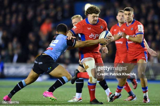 Alfie Barbeary of Bath Rugby is tackled by Ben Thomas of Cardiff Rugby during the Investec Champions Cup match between Cardiff Rugby and Bath Rugby...