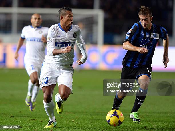 Michele Canini of Atalanta BC and Fredy Guarin of FC Inter Milan compete for the ball during the Serie A match between Atalanta BC and FC...