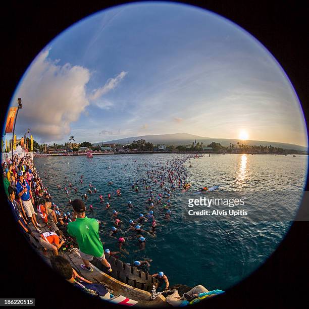 Triathletes await the start of the 2.4 mile swim portion of the Ironman World Championships on October 12, 2013 in Kailua Bay, Hawaii.