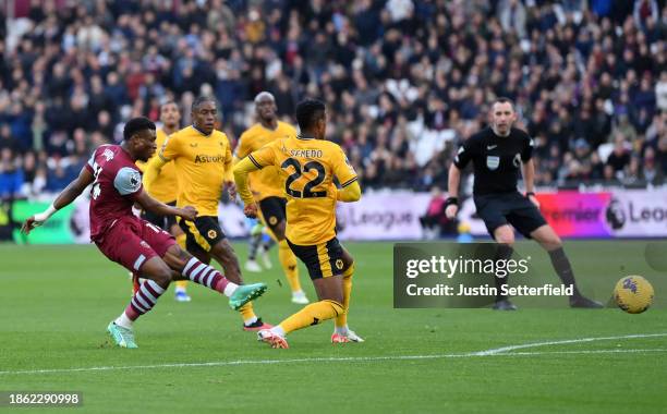 Mohammed Kudus of West Ham United scores their team's first goal during the Premier League match between West Ham United and Wolverhampton Wanderers...