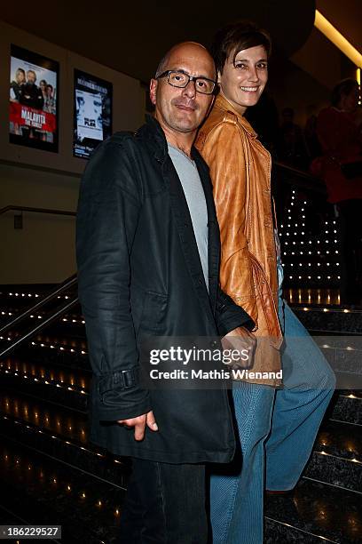 Christoph Maria Herbst and his wife Gisi Herbst attend the premiere of "King Ping" at Cinemaxx Wuppertal on October 29, 2013 in Wuppertal, Germany.