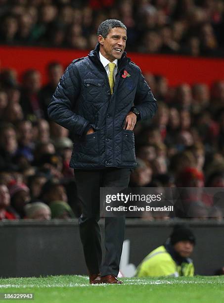 Norwich City manager Chris Hughton gives instructions to his team during the Capital One Cup Fourth Round match between Manchester United and Norwich...