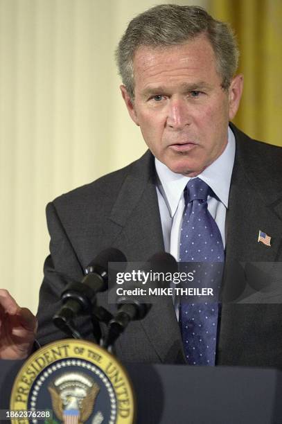 President George W. Bush urges Congress to pass a USD 15 billion bill to fight AIDS internationally during an event in the East Room 29 April 2003 at...