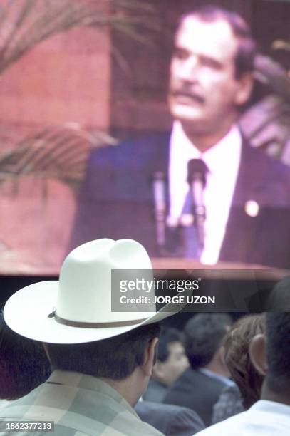 Farmer is seen listening to Mexican President Vicente Fox's speech during ceremonies in Mexico City 28 April 2003. Un campesino escucha el discurso...