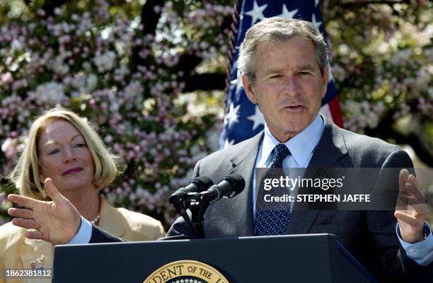 President George W. Bush speaks along side Christine Bierman Founder and CEO, Colt Safety, Fire and Rescue in the Rose Garden of the White House...