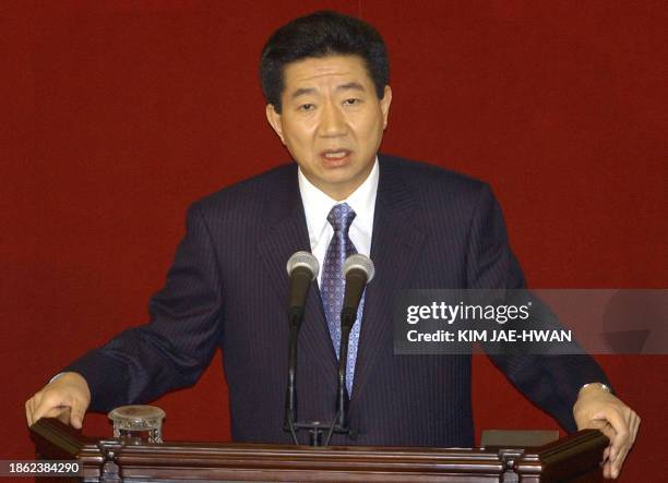 South Korean President Roh Moo-Hyun delivers his speech to the National Assembly to endorse his pledge to dispatch 700 non-combattants to help the...