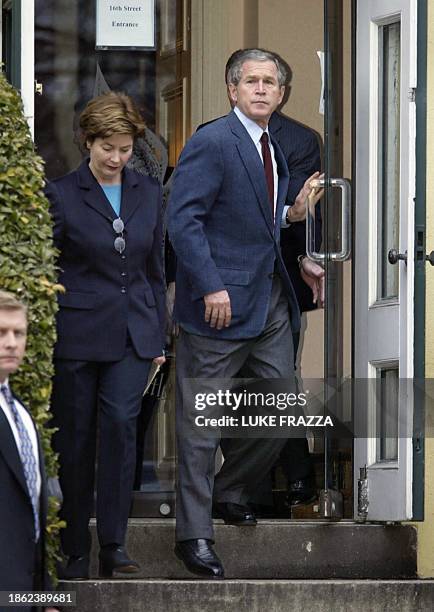 President George W. Bush and First Lady Laura Bush leave St. John's Protestant Episcopal Church in Washington, DC 02 February 2003 after attending...